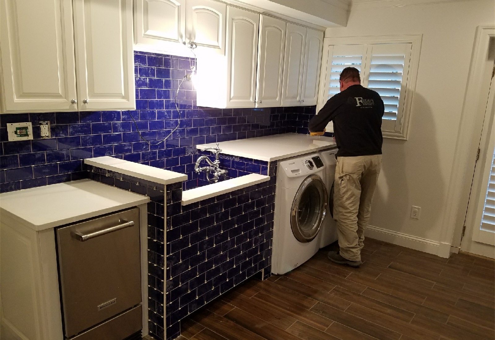 Tile backsplash and laundry room finish work in progress